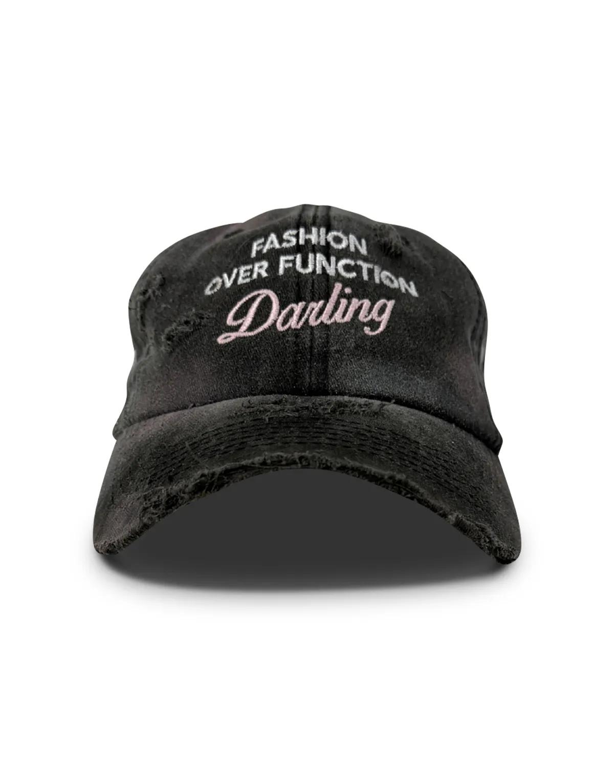 Hand distressed grey denim dad cap, front view, with a frayed brim edge and Darling embroidered in pink script